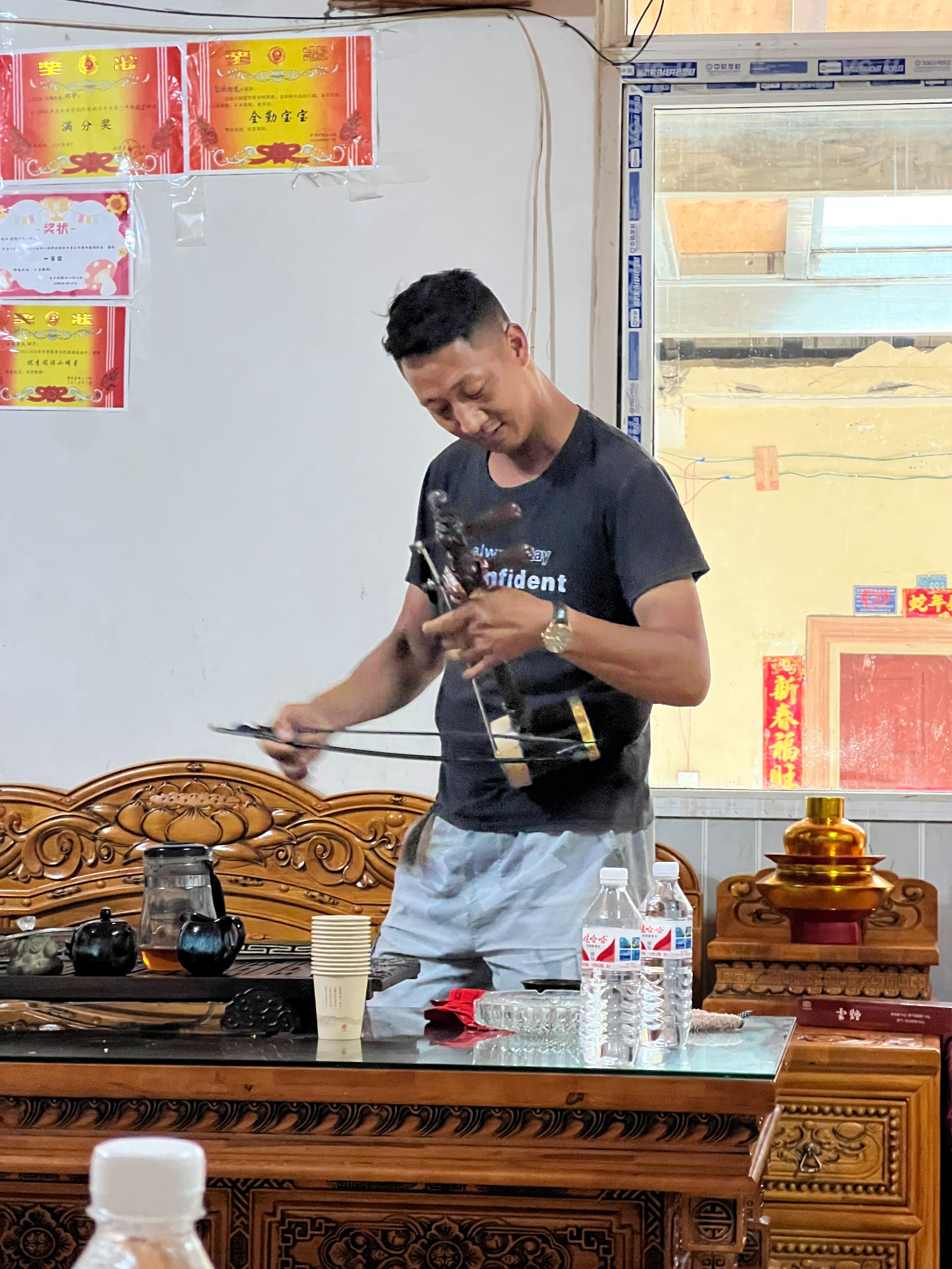 Playing the Xianzi in a local home