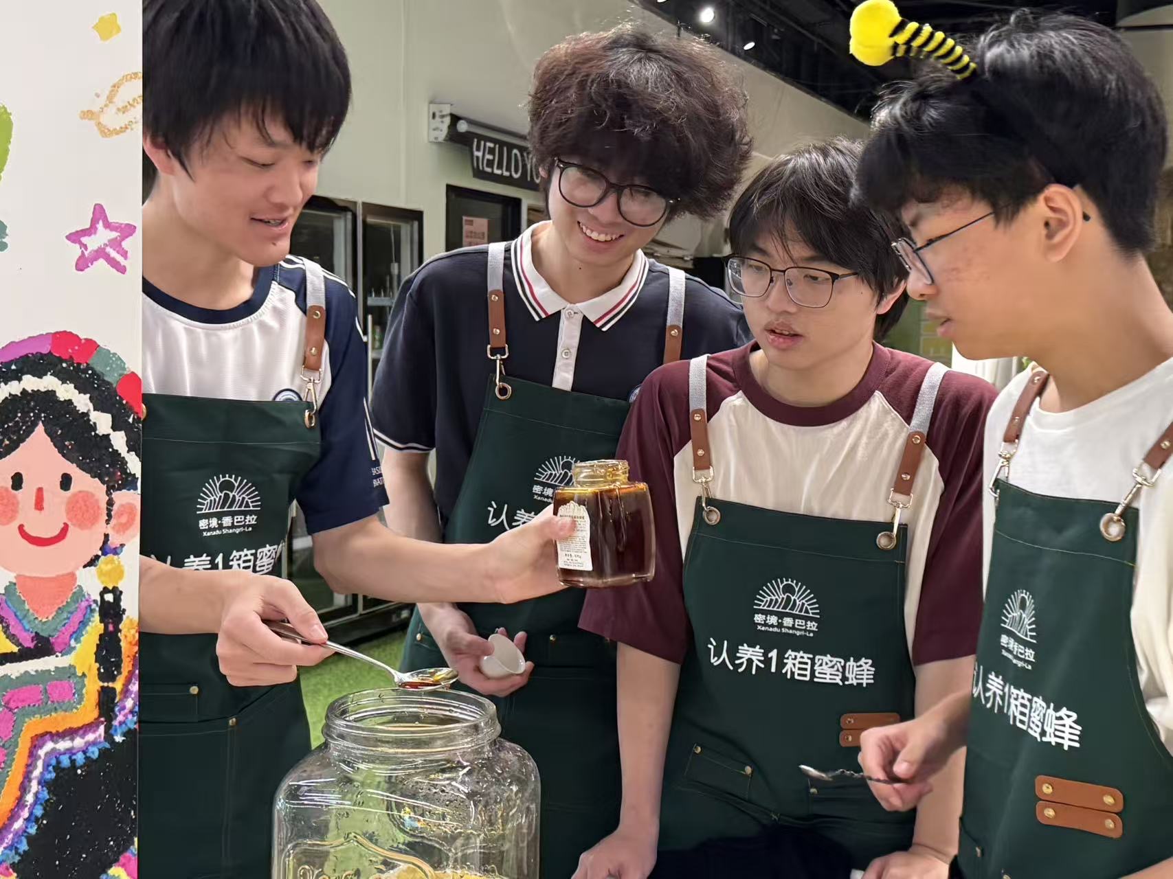 Four student volunteers in green charity-sale aprons tasting honey together at the booth